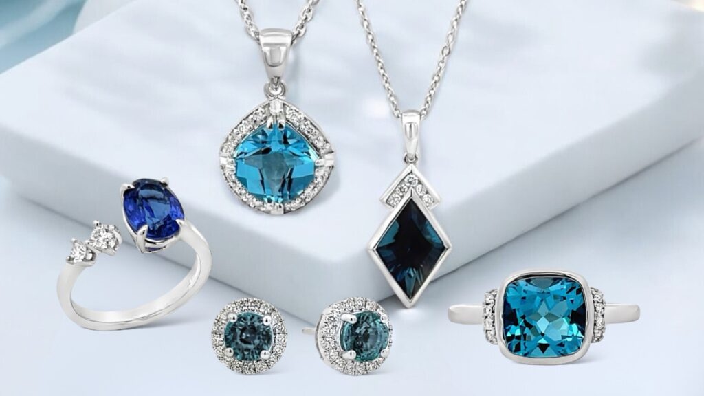Exquisite blue gemstone jewelry collection featuring necklaces, rings, and earrings adorned with diamonds.