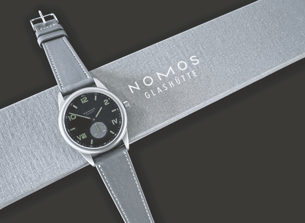 Nomos 50 sitting on a Nomos gift box