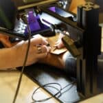 Permanent jewelry bracelet being soldered around a female's writs