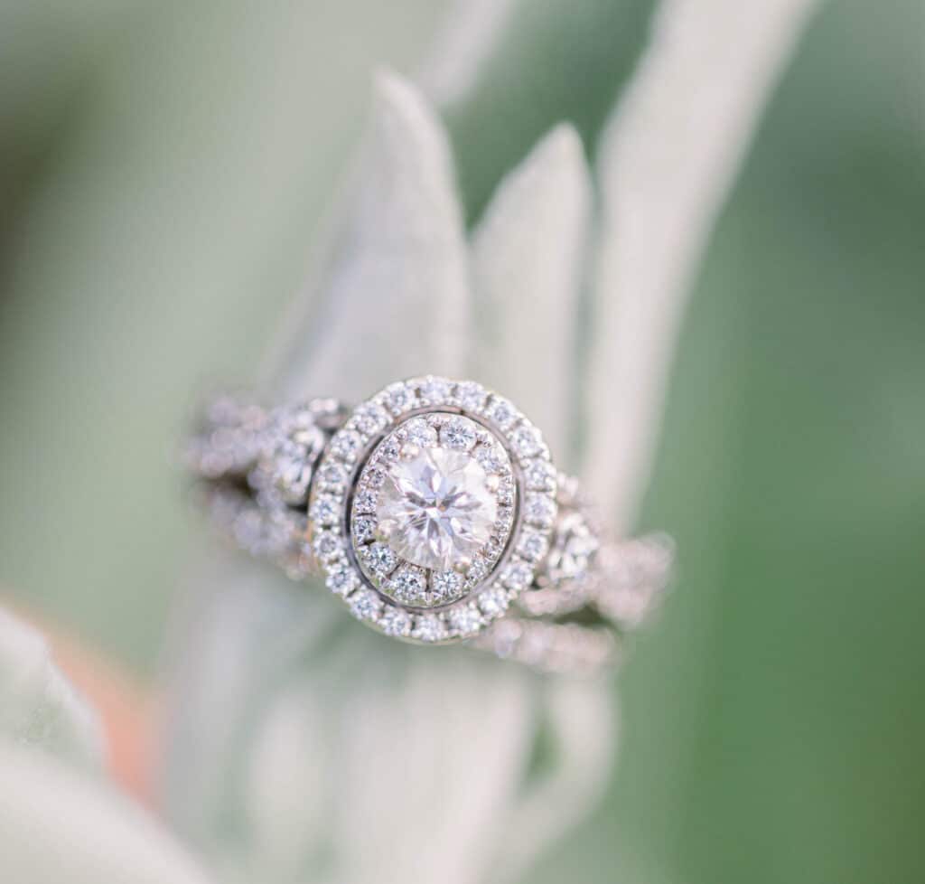 oval diamond ring on a stem plant