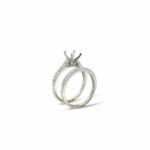 Elegant silver engagement ring and wedding band set showcasing exquisite craftsmanship and timeless design.