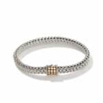 Elegant silver braided bracelet with gold centerpiece, perfect for versatile styling and high-quality craftsmanship.