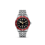 Luxurious Tudor dive watch with stainless steel case, red ceramic bezel, and black dial.