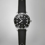 Oris diving watch featuring stainless steel case, black dial, and rubber strap for underwater adventures.