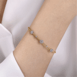 Elegant yellow gold bracelet with sparkling silver accents, perfect for any occasion.