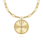 Elegant gold necklace with a diamond pendant and unique sunburst design for modern accessories.