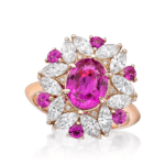 Elegant fuchsia gemstone ring with diamonds in rose gold, perfect for special occasions.