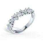 Elegant diamond ring with stunning round and rectangular cuts, perfect for engagements or anniversaries.