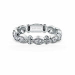 Elegant silver ring with intricate patterns and sparkling gemstones for a luxurious look.