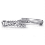 Elegant silver hair clip with bead accents and intricate cutout design for stylish hair fashion.