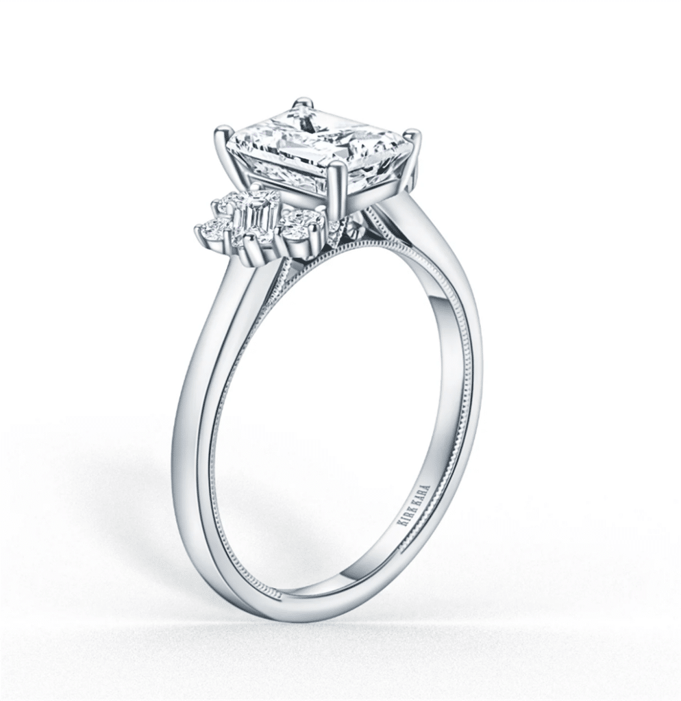 Elegant emerald cut diamond engagement ring featuring tapered baguette sides in a sleek band.