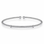 Elegant silver bracelet with rhinestones, polished beads, and adjustable open-ended design.