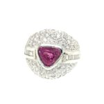 Elegant pink gemstone ring with diamonds, showcasing luxury and exquisite craftsmanship.