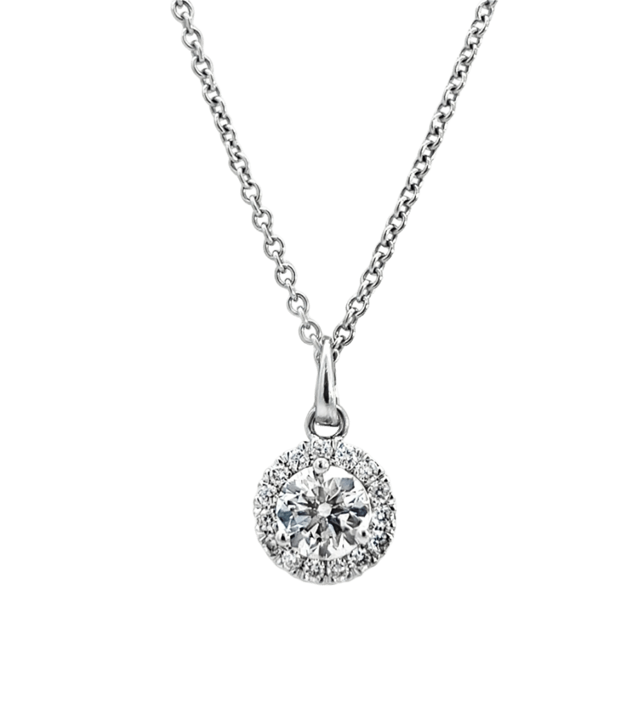 Elegant diamond pendant necklace with sparkling central stone and halo, set on a silver chain.