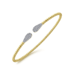 Stylish gold and silver bracelet with beaded design and teardrop accents, perfect for any occasion.