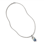 Elegant silver necklace with colorful talisman pendant, showcasing unique craftsmanship and artistic design.