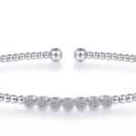 Stylish silver bracelet with polished beads, perfect for layering or as a statement piece.