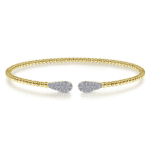 Elegant gold cuff bracelet with sparkling teardrop accents, perfect for modern style and versatility.