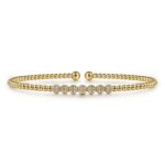 Elegant gold bracelet with sparkling stones, perfect for casual and formal occasions.