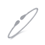 Elegant silver cuff bracelet with sparkling pear-shaped ends, perfect for any occasion.