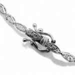 Elegant marquise-shaped bracelet with sparkling gemstones in silver or white gold.