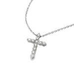 Elegant cross necklace with sparkling stones on a slim silver chain, perfect for any occasion.