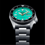 Vibrant Seiko dive watch with turquoise dial, stainless steel bracelet, and luminous markers for diving.