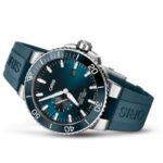 Oris Aquis diving watch features a blue dial, stainless steel case, and rubber strap.