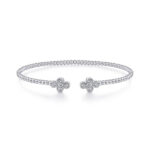 Elegant silver bracelet with floral motifs and sparkling stones for versatile, sophisticated style.