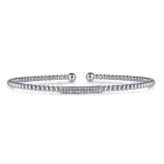Elegant silver bracelet with textured beads and sparkling central gemstones for timeless sophistication.