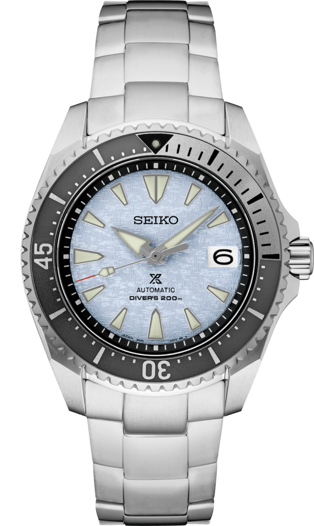 Seiko automatic dive watch with blue dial, stainless steel case, and luminescent markers.