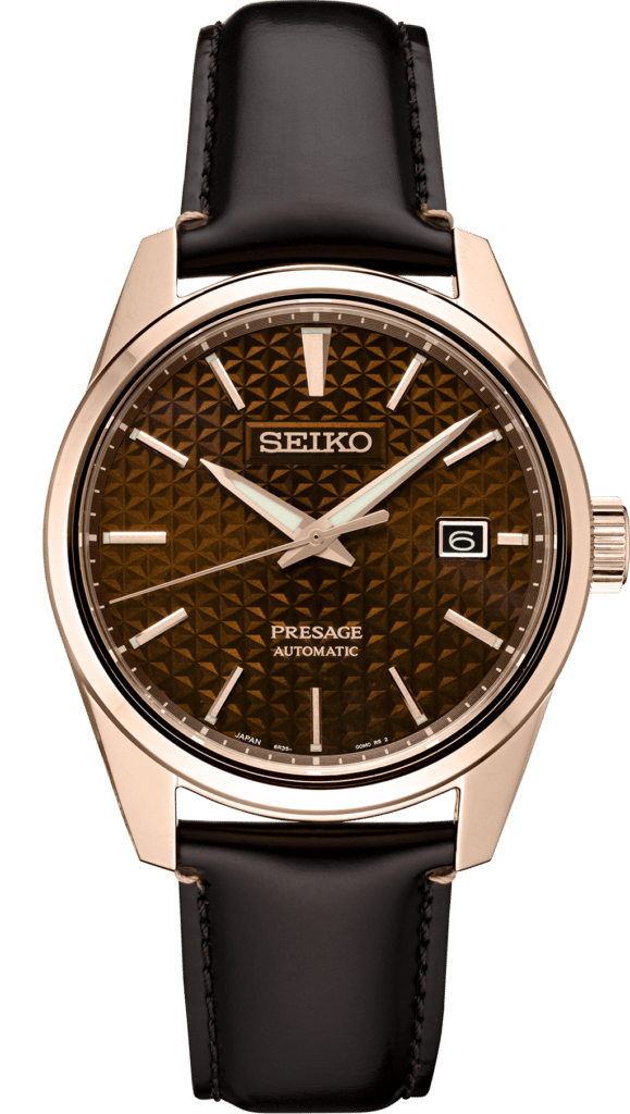 Elegant Seiko Presage watch with rose gold case, leather strap, and unique brown dial.