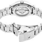 Polished stainless steel Seiko watch with an elegant design and transparent case back.