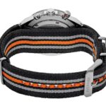 Stylish wristwatch with a black fabric strap featuring vibrant orange and gray stripes.