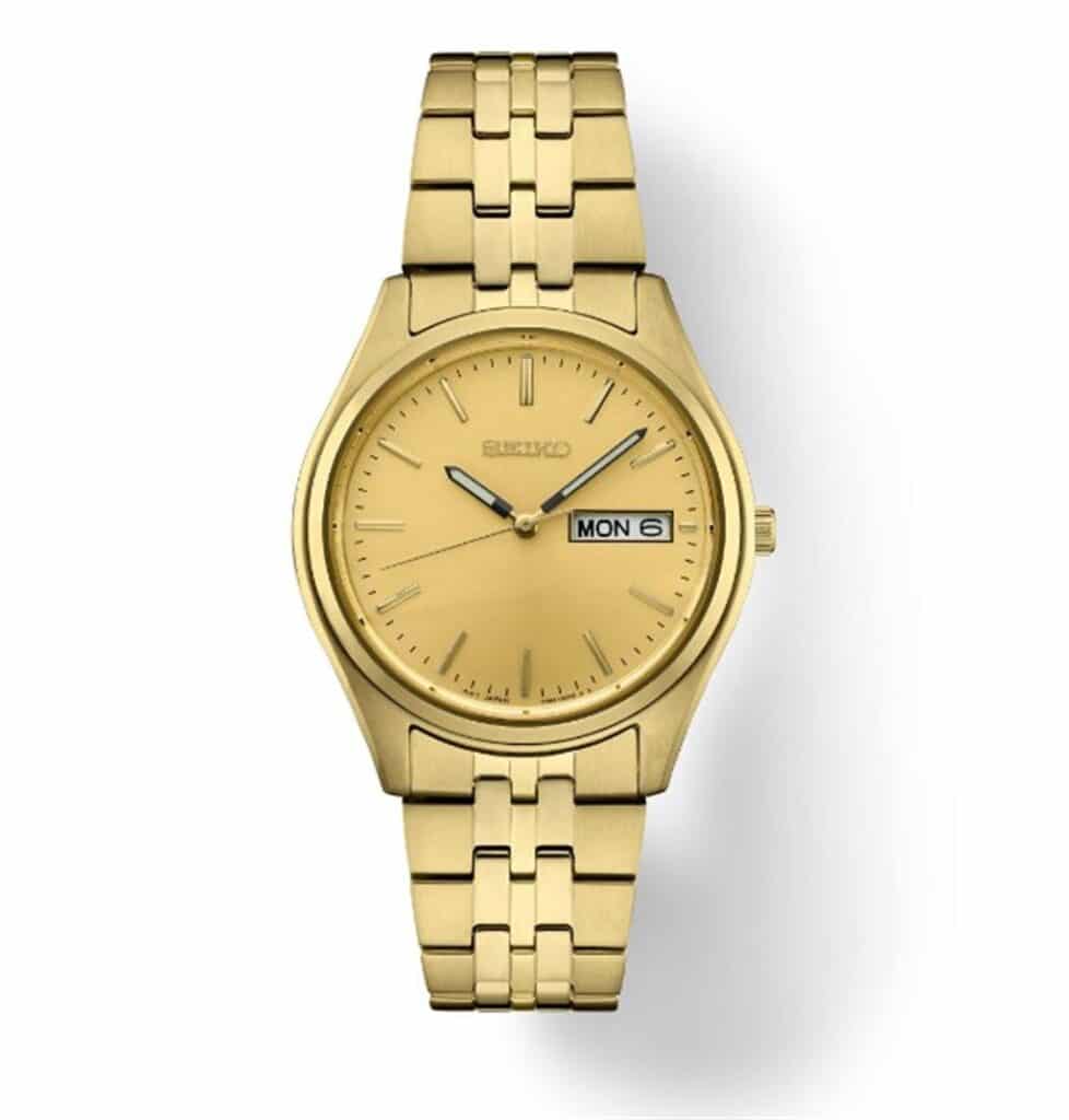 Elegant Seiko gold wristwatch with minimalist design, polished case, and practical date function.