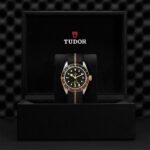 Luxury Tudor watch in elegant black packaging, showcasing classic design and modern craftsmanship.