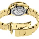 Luxurious gold watch with polished design and transparent case showcasing intricate movement.