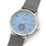 NOMOS Glashütte minimalist watch with blue dial and grey NATO strap for stylish timekeeping.