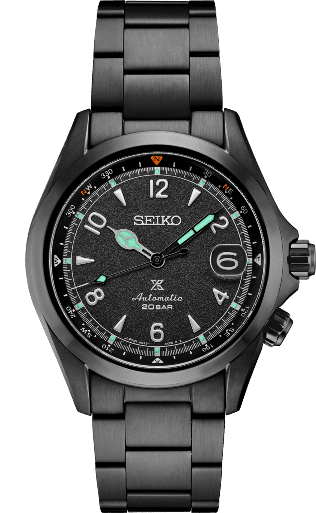 Stylish Seiko watch with black metal case, luminous hands, and sporty design for outdoor adventures.