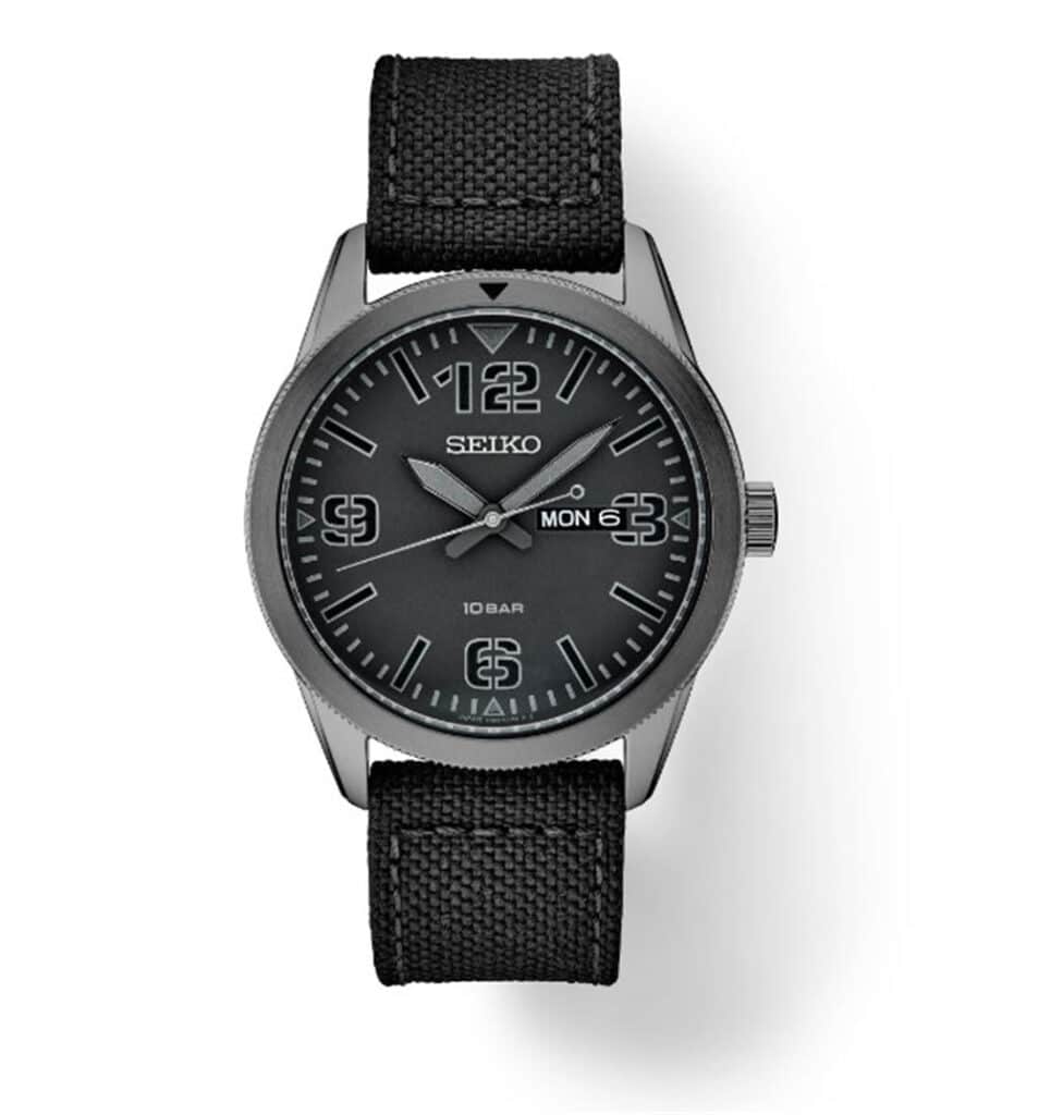 Stylish Seiko sport watch with black design, luminous dial, and durable fabric strap.