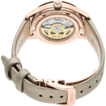 Elegant Seiko watch with rose gold case, exhibition back, and leather strap, showcasing craftsmanship.