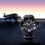 Black G-SHOCK watch in front of a luxury private jet at dusk, showcasing precision and durability.