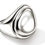 Elegant modern sculptural silver ring with a polished surface and fluid organic design.