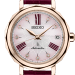 Elegant Seiko wristwatch with rose gold case, mother-of-pearl dial, and burgundy leather strap.