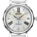 Elegant Seiko watch with octagonal case, mother-of-pearl dial, and white leather strap.
