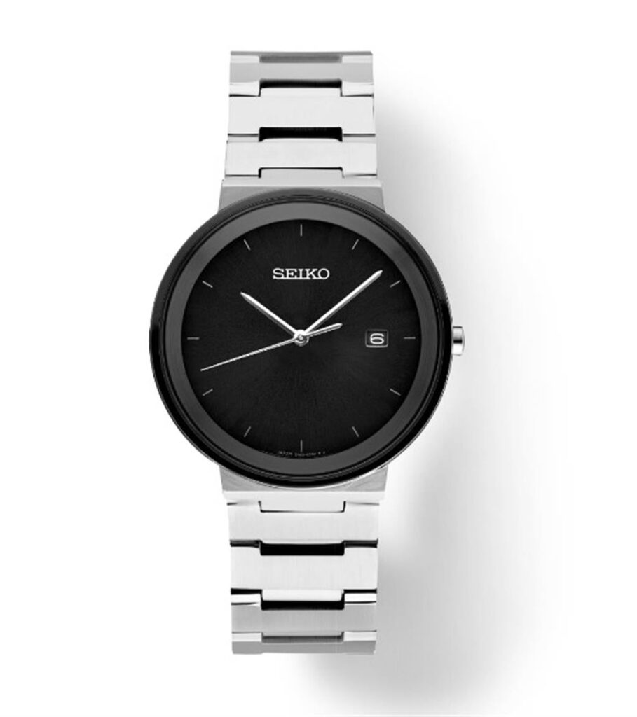 Elegant Seiko watch with black dial, silver hour markers, and stainless steel bracelet for versatile style.