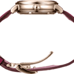 Elegant wristwatch with burgundy leather strap and polished metal case, showcasing fine craftsmanship.