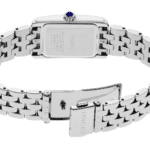 Elegant stainless steel watch with intricate detailing and a luxurious blue cabochon stone.