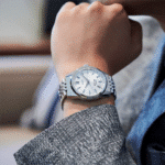 Stylish wristwatch on a sophisticated hand, showcasing modern elegance in professional attire.