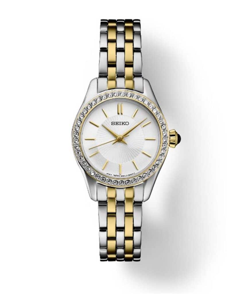 Elegant Seiko watch with crystal bezel, two-tone bracelet, and sophisticated white sunburst dial.